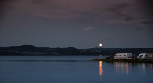 Scenic view of sea against sky at night