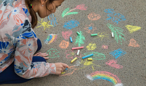 High angle view of girl playing with toys