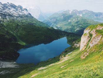 Scenic view of lake with mountains in background