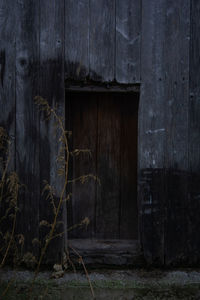 Old wooden door of abandoned house