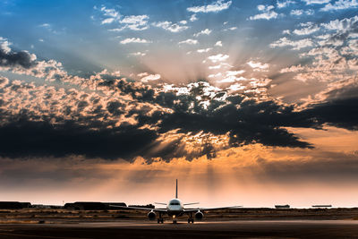 Scenic view of landscape against cloudy sky