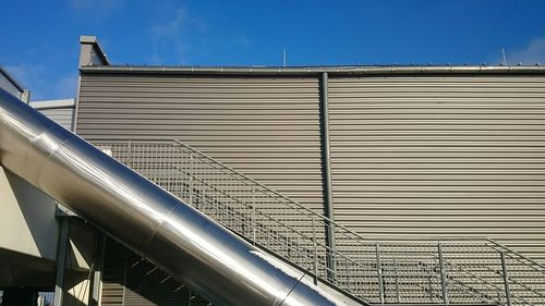 Low angle view of built structure against blue sky