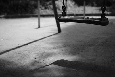 Close-up of swing hanging in park
