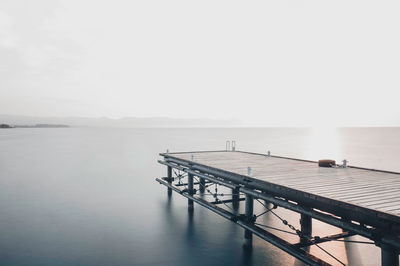 Pier over sea against sky