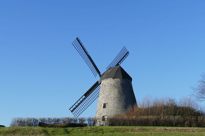 Historical windmill against blue sky, panoramic view 