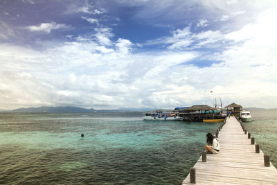 Pier over sea against sky