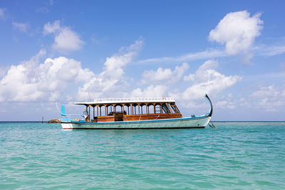 Boat in sea against sky