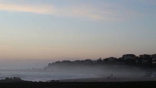 Scenic view of sea against sky during foggy weather