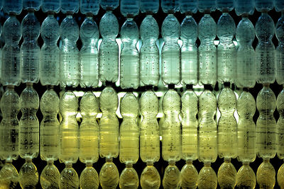 Artistic full frame shot of water plastic bottles