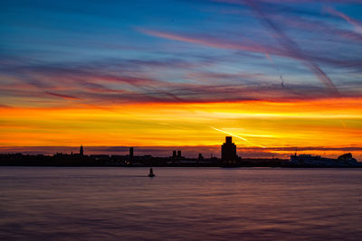 Silhouette of city at sunset