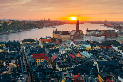 High angle view of city buildings during sunset