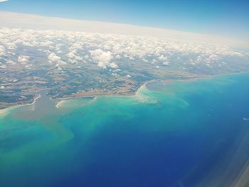 Aerial view of sea and landscape against sky