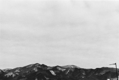 Low angle view of mountain range against sky