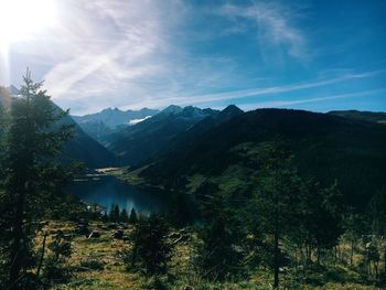 Calm lake against mountain range