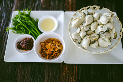 Oysters on the bowl and side dishes.