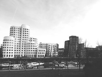 Buildings in city against sky