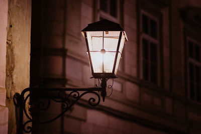 Close-up of illuminated lamp on wall