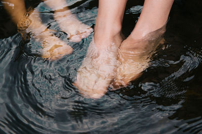 Low section of people in swimming pool