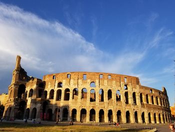 Low angle view of historical building against blue sky