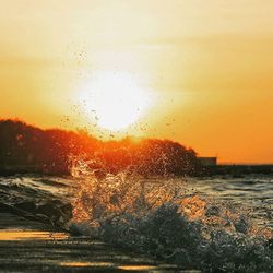 Scenic view of sea at sunset