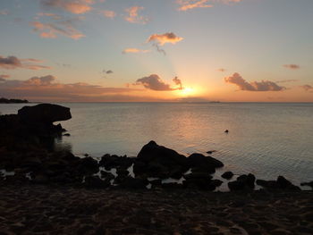 Scenic view of sea against sky during sunset