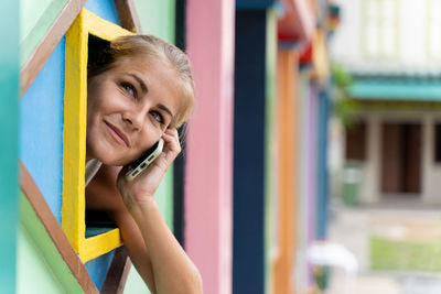 Portrait of teenage girl in multi colored outdoors