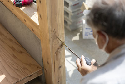 Side view of man working at home