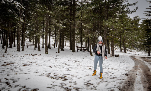 Man standing on snow covered land