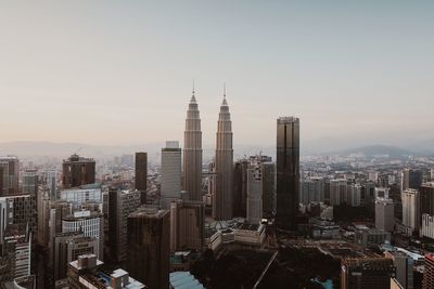 Modern buildings in city against sky