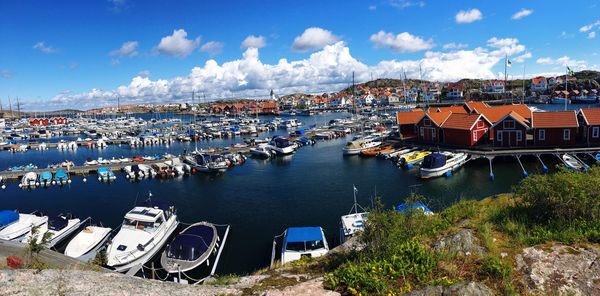 High angle view of townscape by sea against sky