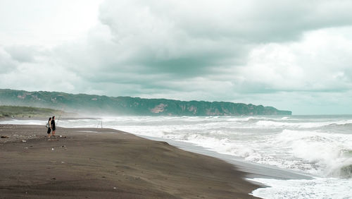 Scenic view of beach against sky