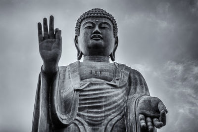 Low angle view of statue against sky