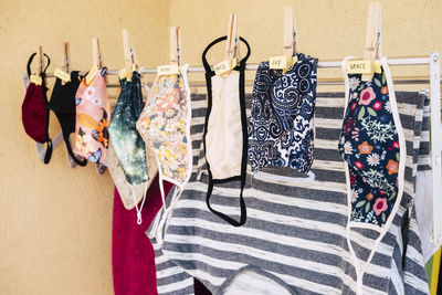 Various clothes hanging on rack