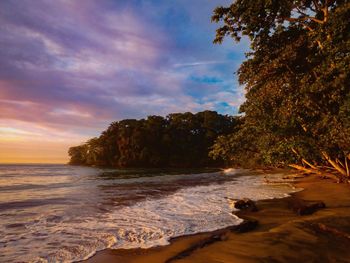 Scenic view of sea against sky at sunset