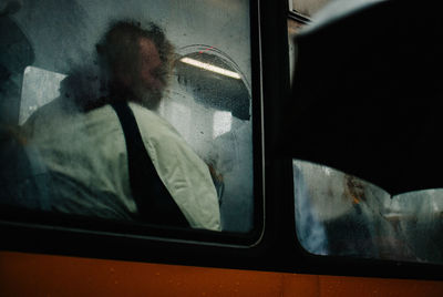 Man seen through train window