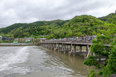 Bridge over river against sky