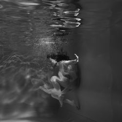 Woman swimming in pool