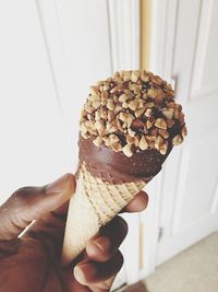 Close-up of hand holding ice cream