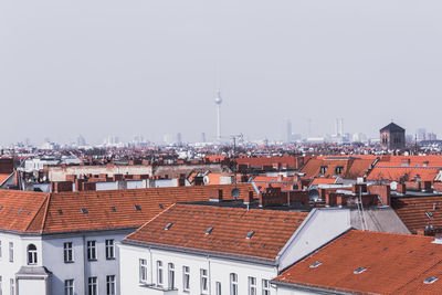 Buildings in city against clear sky