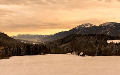 Scenic view of landscape against sky during winter