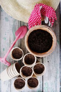 Dirt in containers on table