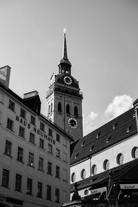 Low angle view of clock tower against sky