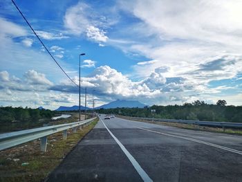 Empty road against sky