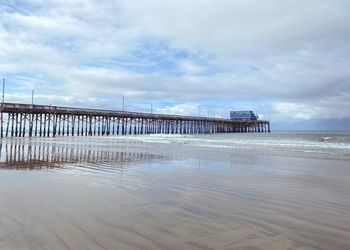 Pier over sea against sky