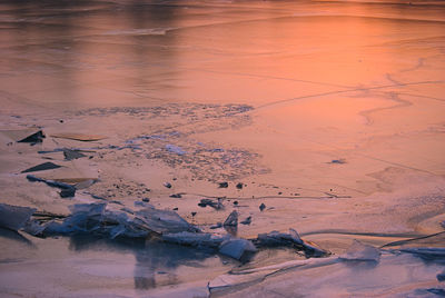 Scenic view of frozen lake against sky during winter