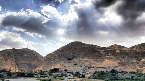 View of mountain range against cloudy sky