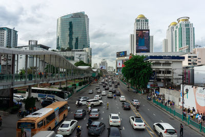 High angle view of city street and buildings against sky