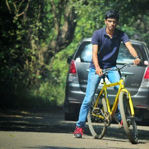 Man riding bicycle on road