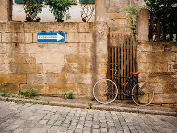 Bicycles parked against wall