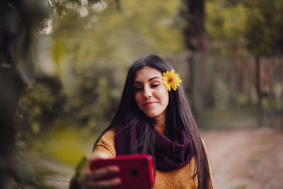 Portrait of beautiful young woman outdoors